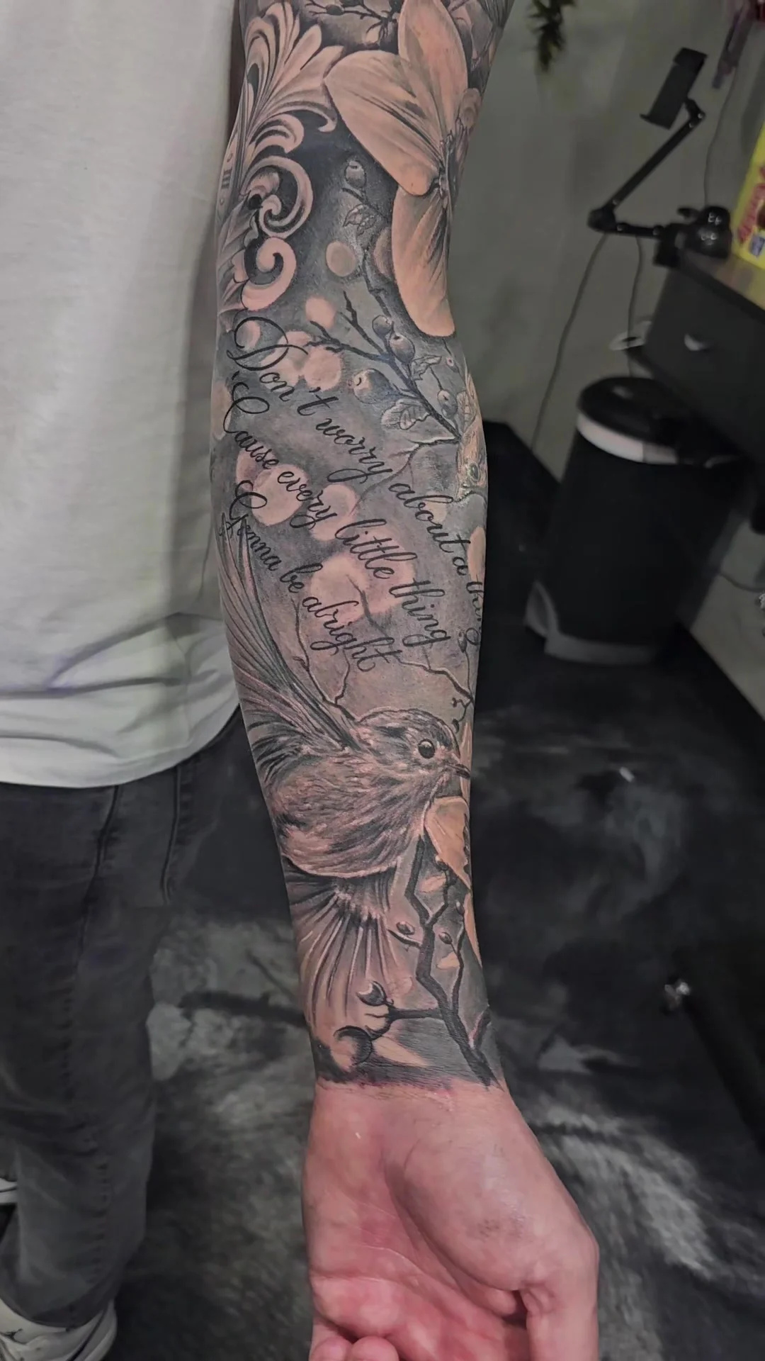Three little birds sleeve tattoo with Bob Marley lyrics by Alex Zamora