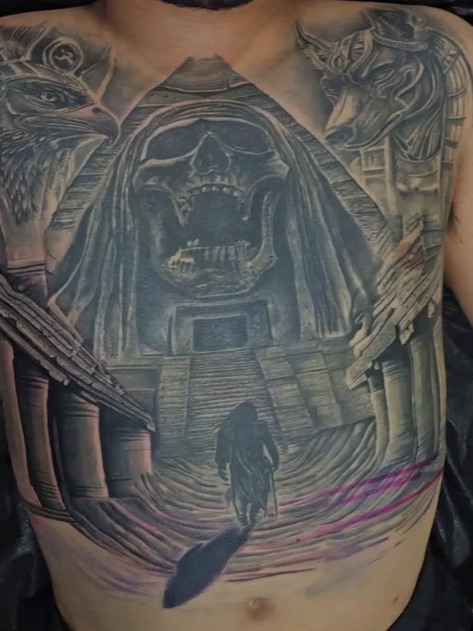 Egyptian pyramid with skull, Horus and Anubis chest tattoo by Alex Zamora